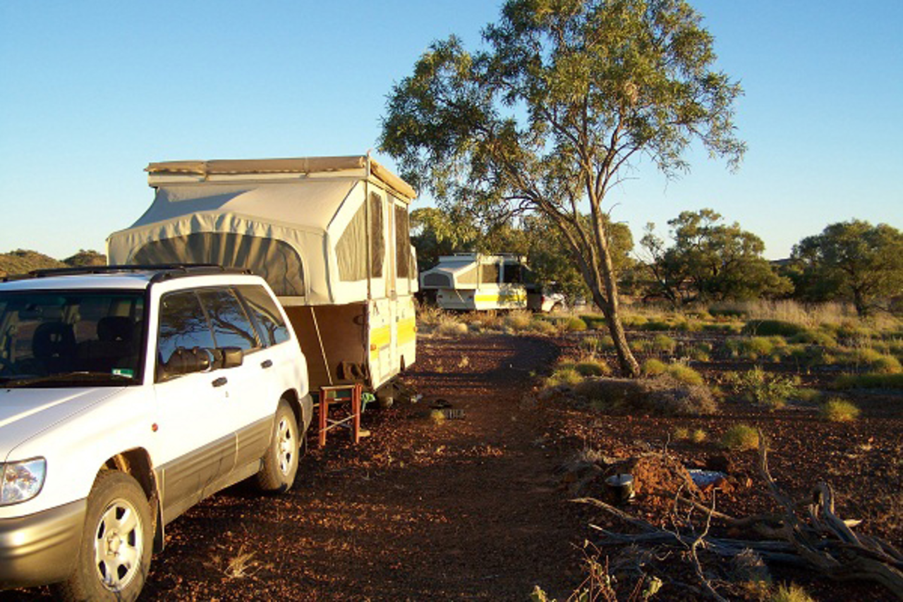 photo of car with caravan in outback