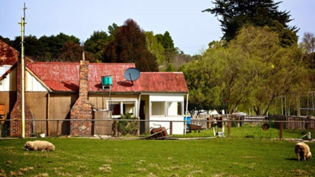 Photo of rural home with satellite dish